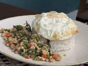 Phat Kaphrao ( Thai  basil stir-fry with minced meat with rice topped with a fried egg )