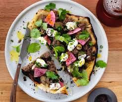HANDMADE FLATBREAD (Julio's handmade faltbread wrapped with beef mine and lettuce, topped with Agora yoghurt)