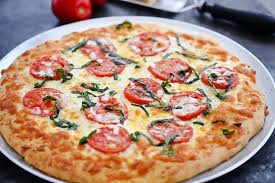 Margarita Pizza ( pizza based sauce, fresh tomato, fresh fresh basil, olive oil & cheese)