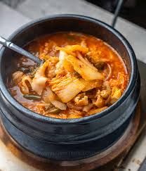 Kimchi Jjigae ( Kimchi stew with pork meat and homemade tofu Served with Rice )