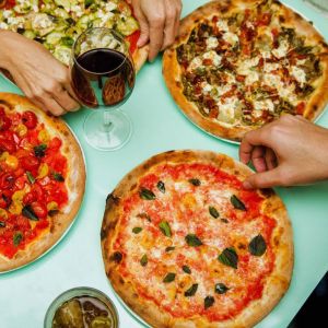 Maialate pizza ( tomato sauce, mozzarella, chorizo, salami, Italian pork mice, ham and Olives )