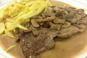 BIFE ( beef mushroom sauce served with chips/rice )