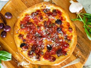 Pizza Napoli (Tomato Sauce, Mozzarella, Anchovies, Capers, Oregano, Chili Flakes)