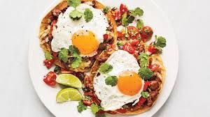 FRIED EGG FALUN FILA (fried egg, chorizo, Ana's hollandaise sauce. All wrapped in purple sweet potato flat bread, guacamole and served with seasonal greens/ salad)