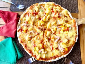 Chicken tropicale pizza ( tomato sauce, mozzarella, chicken, bacon, pineapple and capsium)