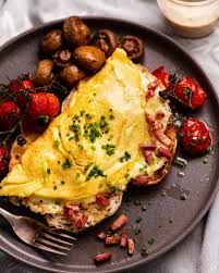 OMELETTE-ham,cheese,tomato & mushrooms served with toast