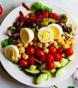 garden salad with olives and boiled eggs