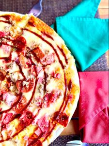 Carne suprema pizza ( tomato sauce, mozzarella, beef mince, bacon,ham, pepproni, salami and BBQ sauce)