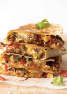 Quesadilla Tortilla with seasoned beef, steak, chicken, pork or grilled vegetables---with cheese, salsa of your choices, folded with grilled & served with sour cream